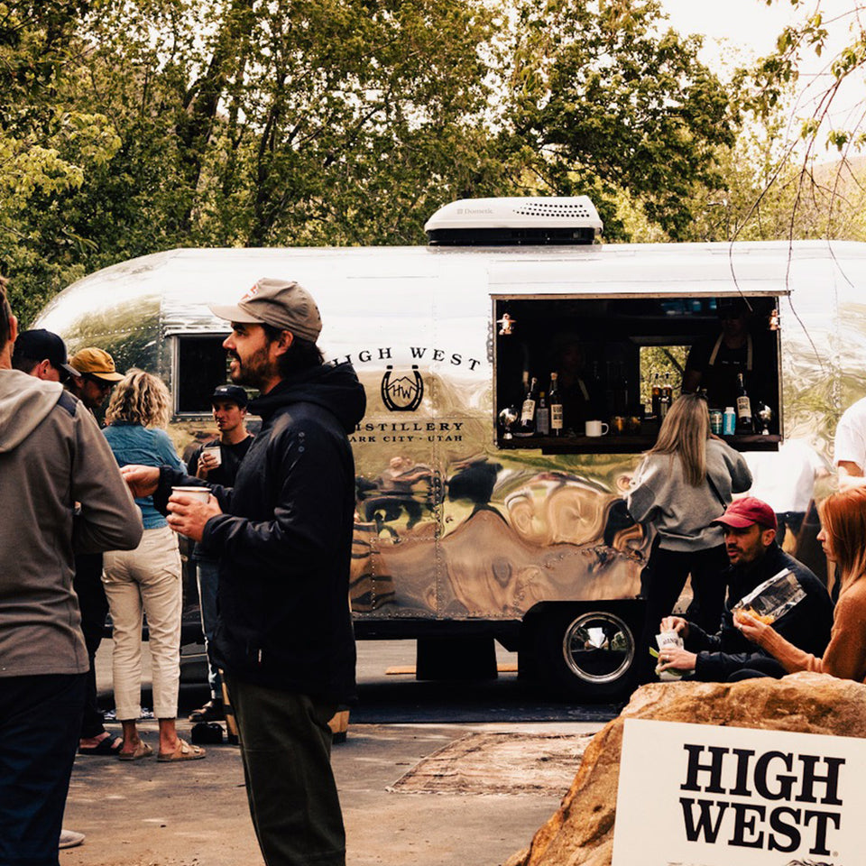 High West airstream parked with group of people drinking outside